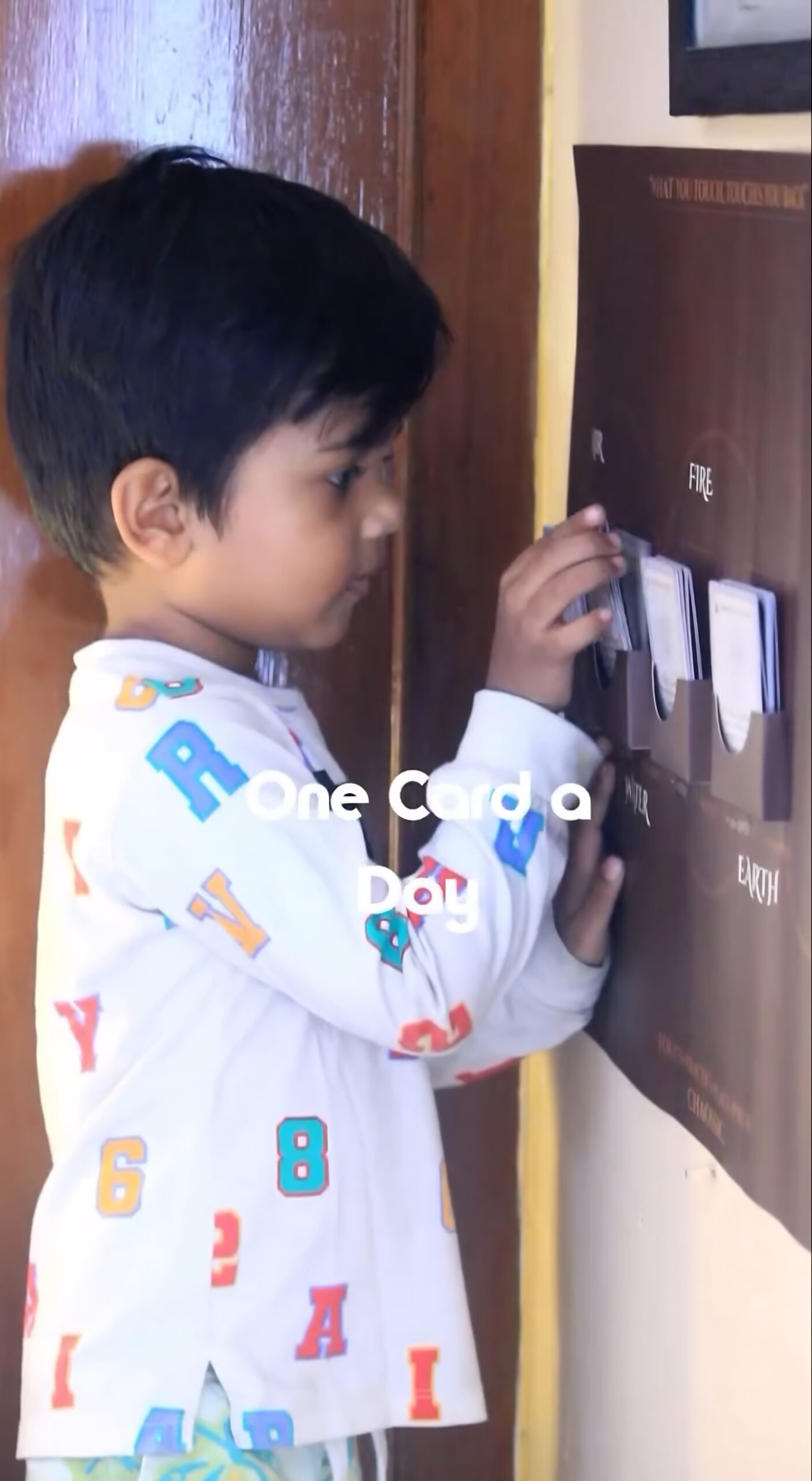 A child and a parent with the cards at home